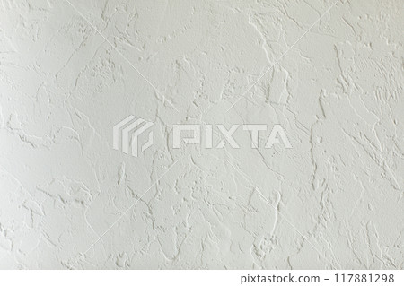 Texture of white plaster on concrete wall, handmade. Modern stucco with irregular surface and grain. Construction, interior or exterior design. Background of grunge grey cement structure, rough top Texture of white plaster on concrete wall, handmade. Modern stucco with irregular surface and grain. Construction, interior or exterior design. Background of grunge grey cement structure, rough top 117881298
