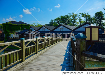 Sankyo Bridge over the Arata River and the blue sky at Sankyo Warehouse 117881412