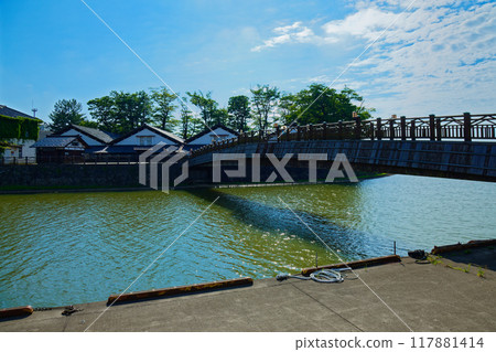 Sankyo Bridge over the Arata River and the blue sky at Sankyo Warehouse 117881414