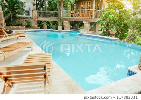 A beautiful and crystal clear swimming pool surrounded by trees. Home swimming pool designs, Beautiful swimming pool surrounded by nature A beautiful and crystal clear swimming pool surrounded by trees. Home swimming pool designs, Beautiful swimming pool surrounded by nature 117882331