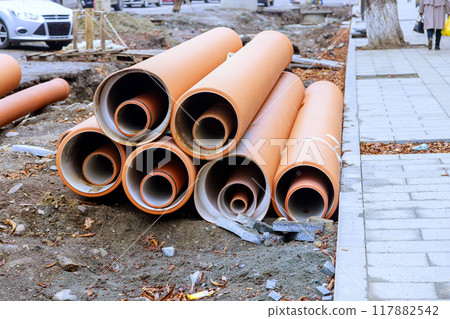 Pipes of HDPE polyethylene sewer waiting to be installed, ready to form backbone of new infrastructure Pipes of HDPE polyethylene sewer waiting to be installed, ready to form backbone of new infrastructure 117882542