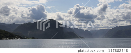 Summer clouds over the Lysefjord in the morning, Norway. Summer clouds over the Lysefjord in the morning, Norway. 117882548