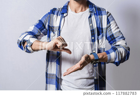 Unrecognizable deaf-mute person speaking in sign language, Hands gesturing in sign language. Person speaking in sign language, Manual gestures of people with hearing and verbal problems 117882783