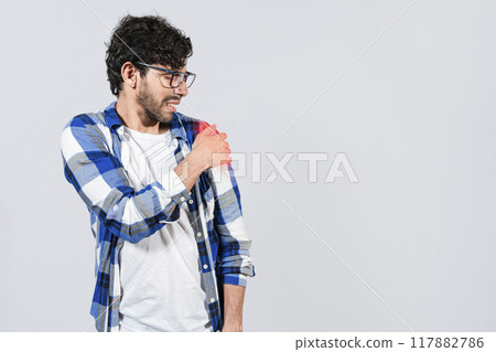 Man suffering from upper arm inflammation. Arm and shoulder pain concept. People with upper arm pain isolated, muscle tension problems, Man with upper arm muscle pain Man suffering from upper arm inflammation. Arm and shoulder pain concept. People with upper arm pain isolated, muscle tension problems, Man with upper arm muscle pain 117882786