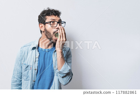 Person with bad breath problem, Concept of person with halitosis and bad breath, a guy with bad breath and halitosis problem 117882861