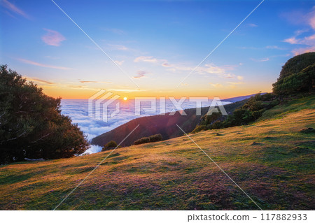 Sunrise above clouds on Madeira island, Portugal Sunrise above clouds on Madeira island, Portugal 117882933