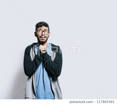 Person pleading with hands together isolated. distressed man asking for a favor, People putting hands together asking please, Hopeful person asking for help or apologizing Person pleading with hands together isolated. distressed man asking for a favor, People putting hands together asking please, Hopeful person asking for help or apologizing 117883365