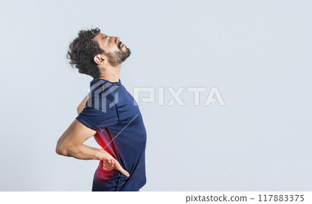 Man with spine problems, person with back problems on isolated background, lumbar problems concept, a sore man with back pain 117883375