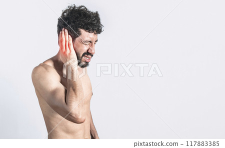 Person with earache on isolated background, man with earache on isolated background, ear disease concept Person with earache on isolated background, man with earache on isolated background, ear disease concept 117883385