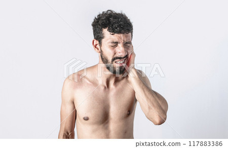 Person with earache on isolated background, man with earache on isolated background, ear disease concept Person with earache on isolated background, man with earache on isolated background, ear disease concept 117883386
