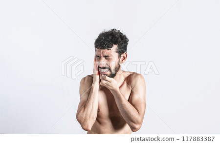 Person with earache on isolated background, man with earache on isolated background, ear disease concept Person with earache on isolated background, man with earache on isolated background, ear disease concept 117883387