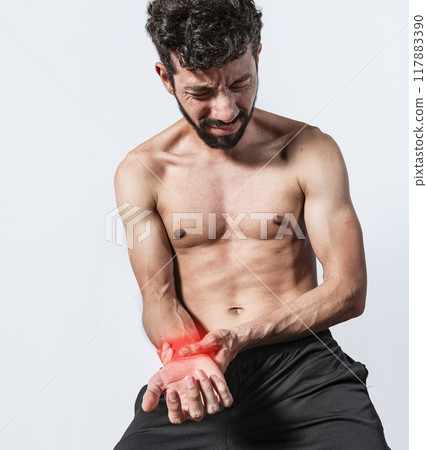 Person with wrist pain isolated, concept of man with pain in the hands, man with arthritis rubbing, person with pain in the wrist, Concept of arthritis in the wrist 117883390