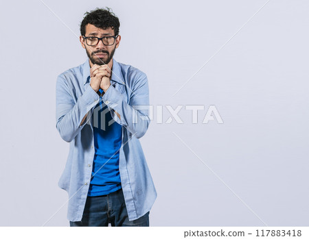 Man asking please, guy putting hands together asking please, worried man apologizing, Hopeful man asking for help or apologizing, man thanking for forgiveness 117883418