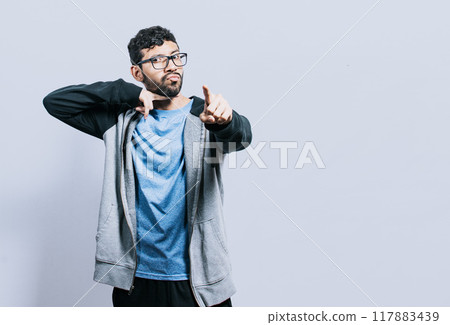 Person threatening with the finger in the throat, A person threatening death, A man with a violent look making threatening signs Person threatening with the finger in the throat, A person threatening death, A man with a violent look making threatening signs 117883439