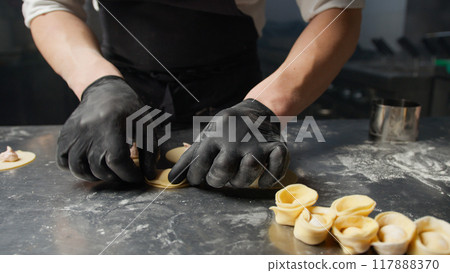 Stuffed Ravioli In The Hands Of A Professional Chef  117888370