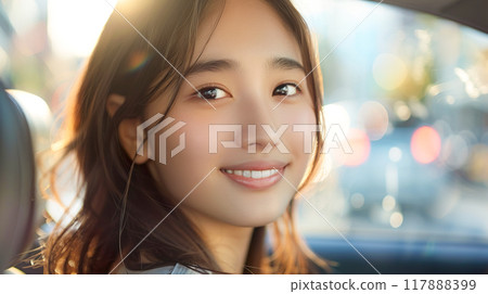 駕車約會時坐在乘客座位上的微笑的年輕女子 117888399