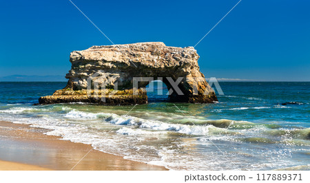 Arch in the sea at Natural Bridges State Beach in Santa Cruz - California, United States 117889371