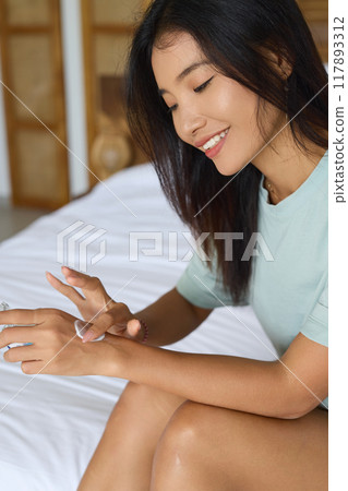 Skin Care. Woman Applying Hydrating Hand Cream for Soft and Glowing Skin Care Skin Care. Woman Applying Hydrating Hand Cream for Soft and Glowing Skin Care 117893312