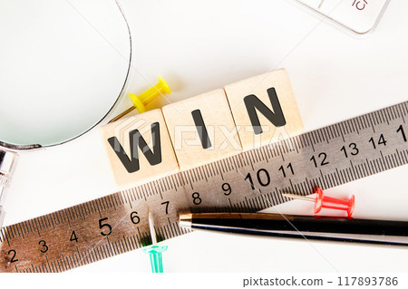 Compromise, perfect. Consent and satisfaction. Trade and diplomacy WIN on wooden cubes next to the measuring ruler Compromise, perfect. Consent and satisfaction. Trade and diplomacy WIN on wooden cubes next to the measuring ruler 117893786