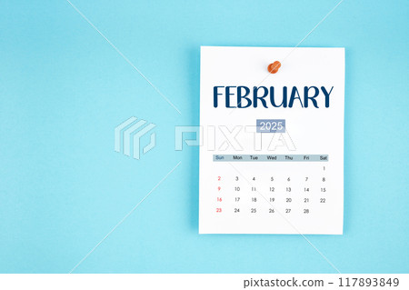 February 2025 calendar page with push pin on blue background. 117893849