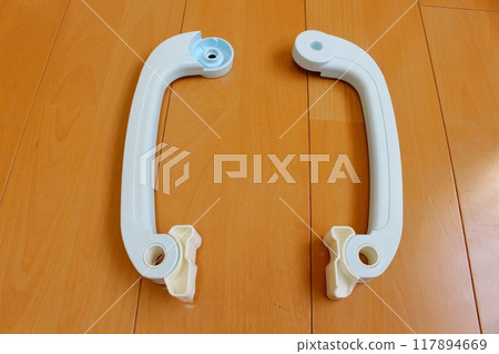 Broken futon clips on the floor 117894669