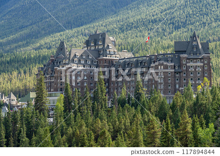 Banff, Alberta, Canada - AUG 28 2020 : Fairmont Banff Springs in summer sunny day. View from Surprise Corner Viewpoint. Banff National Park, Canadian Rockies. Banff, Alberta, Canada - AUG 28 2020 : Fairmont Banff Springs in summer sunny day. View from Surprise Corner Viewpoint. Banff National Park, Canadian Rockies. 117894844