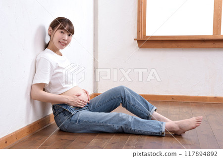 Young pregnant woman 117894892