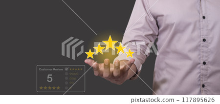 Costomer Review, Young Man hold five star to review and give 5 stars  117895626