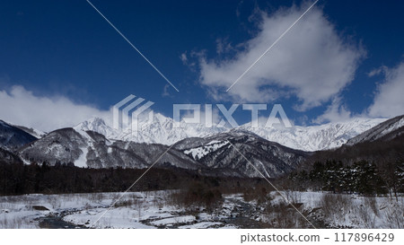 Winter in the Northern Alps and melting snow on the river in Hakuba Village, Nagano Prefecture 117896429