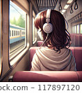 Back view of a woman listening to music with headphones on a train 117897120