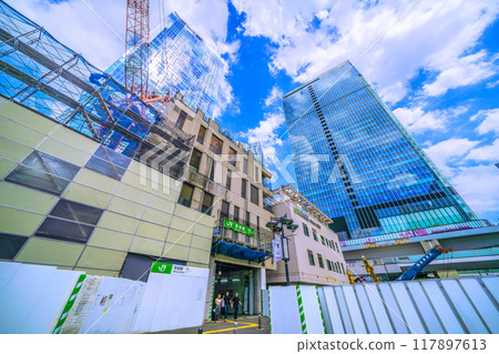 Tokyo cityscape in Japan: Farewell to the west exit of Shibuya Station... Demolition progresses, allowing the summer sky to be seen... Fluffy clouds pass by = August 1st 117897613