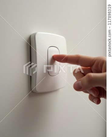 Hand pressing a switch button Hand pressing a switch button 117898319