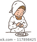 A mother in an apron makes rice balls 117898425