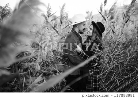 Lovely hipster couple enjoying each other in the autumn park. Nice autumn day. love and lifestyle. 117898991