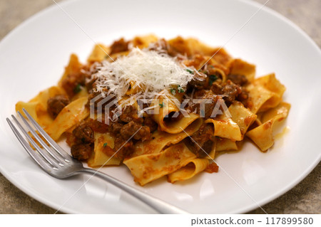 Homemade pappadelle with lamb ragu sauce 117899580