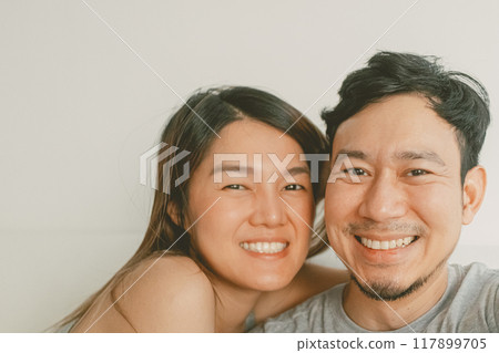 Selfie shot of asian sweet couple lover watching movie together. Selfie shot of asian sweet couple lover watching movie together. 117899705