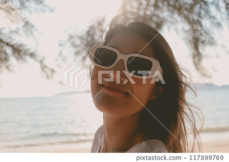 Close up portrait of cheerful woman enjoy the beach vibe. Close up portrait of cheerful woman enjoy the beach vibe. 117899769