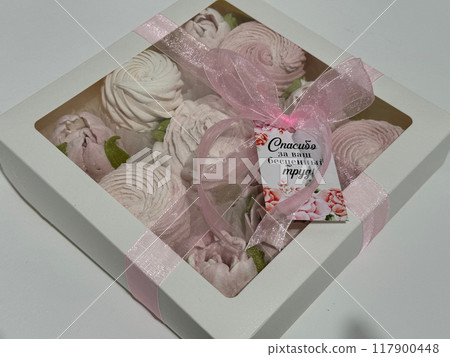 A box of homemade marshmallows. Tied with a ribbon. The tag has the inscription in Russian A box of homemade marshmallows. Tied with a ribbon. The tag has the inscription in Russian 117900448
