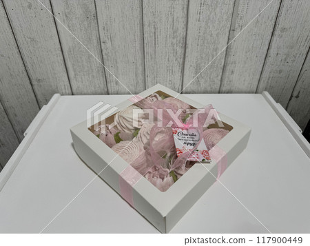 A box of homemade marshmallows. Tied with a ribbon. The tag has the inscription in Russian A box of homemade marshmallows. Tied with a ribbon. The tag has the inscription in Russian 117900449