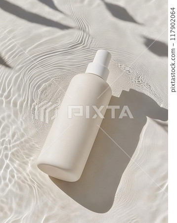 White cosmetic bottle lying on water surface with ripples 117902064