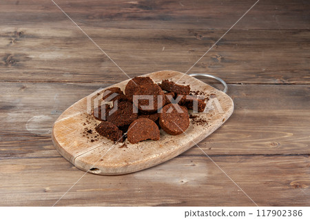 Used ground coffee tabs, waste from espresso machine isolated on white background. Natural body scrub ingredient, garden fertilizer. 117902386