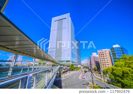Yokohama cityscape in Japan: View of Yokohama City Hall and the Sakuragicho Station entrance from the pedestrian bridge in front of the new south exit of Sakuragicho Station (August 17th) 117902876
