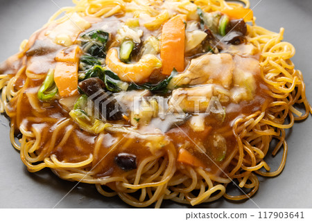 Delicious Chinese food, frozen mixed vegetable fried noodles with thickened sauce 117903641