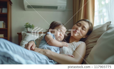 Mother and baby sleeping peacefully in a cool room with air conditioning on a warm day Mother and baby sleeping peacefully in a cool room with air conditioning on a warm day 117903775