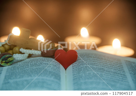 Heart space on top of a Bible with customizable space for text or religion message. Christianity and Religious concept 117904517
