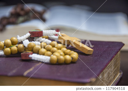Holy Rosary on top of an old Bible. Christianity and Religious concept 117904518