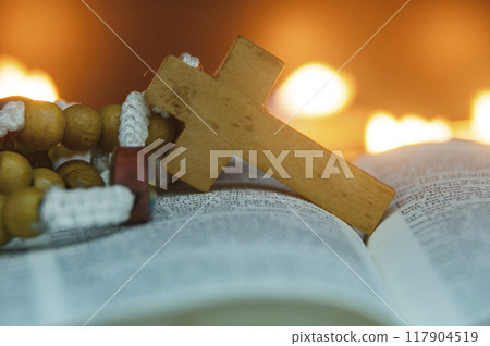 Close up of Holy Rosary on top of a Bible. Christianity and Religious concept 117904519