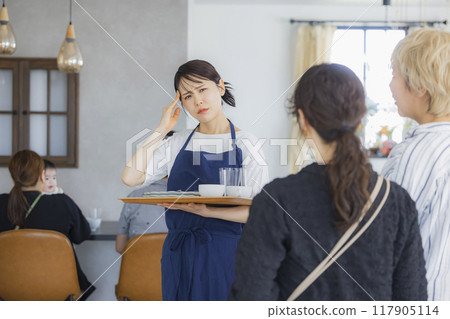 A cafe attendant giving directions A cafe attendant giving directions 117905114