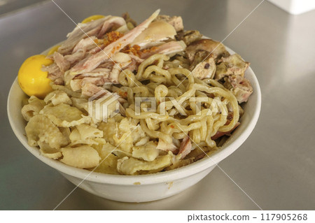 A bowl of Mie Ayam with various toppings. A bowl of Mie Ayam with various toppings. 117905268