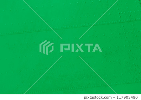 Riveted metal plates, painted and weathered green. 117905480